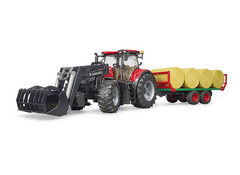 Case IH Optum 300CVX mit Frontlader und Ballentransportanhänger